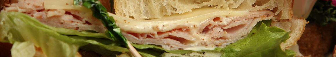 Eating Deli Sandwich at Tina's Deli restaurant in San Marcos, CA.